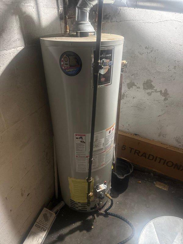 Performed scheduled maintenance on standard tank-type water heater. Inspected all plumbing connections, checked temperature and pressure relief valve, and verified proper venting. Unit appears to be in normal working condition with no signs of leaks or deterioration.