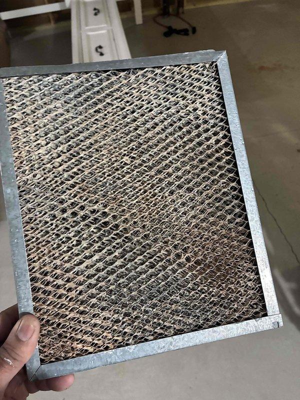 Performed comprehensive furnace system check for new homeowner. Inspected HVAC system components including air handler, ductwork, and water heater connections. Removed and replaced severely soiled air filter which showed significant dust accumulation, restoring proper airflow to the system.