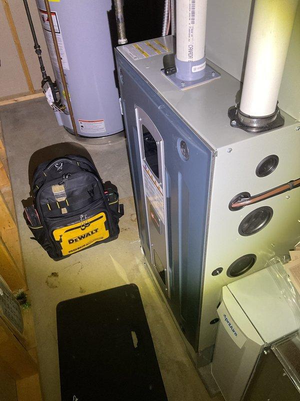 Performed routine heating maintenance on furnace system with Aprilaire humidifier attachment. Inspected all components including ductwork, PVC venting, and digital control panel which displayed normal operation temperature (23°). Changed air filter as scheduled and verified proper system functionality.