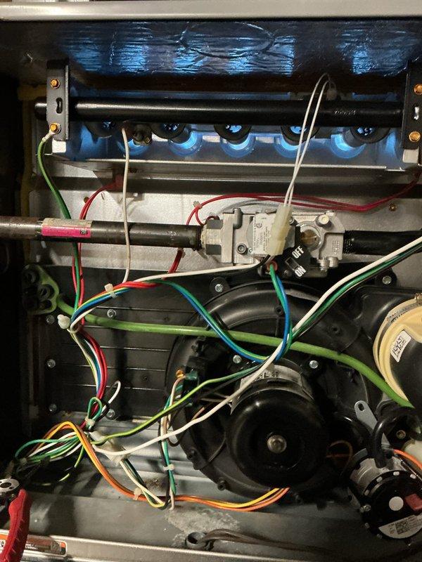 Performed follow-up service call to replace defective pressure switches on customer's gas furnace. Removed access panel, disconnected electrical connections, and installed new pressure switches to restore proper operational safety parameters. Verified proper flame sequence and system operation after replacement, ensuring all components functioning correctly.