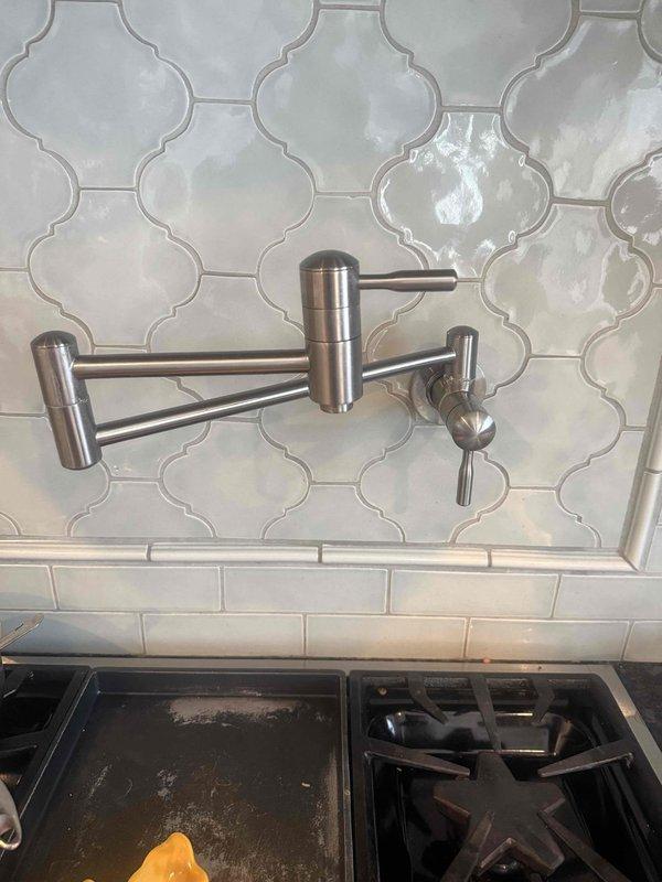 Performed routine maintenance on dual tanked water heater system, completing a comprehensive flush and refill procedure to remove sediment buildup and restore optimal operation. Inspected gas line connection to kitchen stove with pot filler installation as requested by customer. Provided quotes for additional plumbing work identified during courtesy inspection.