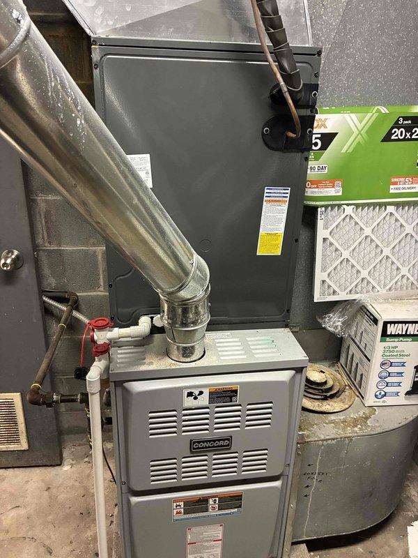 Responded to service call for sanctuary furnace not heating. Performed diagnostic inspection of Concord furnace system, removing access panel to examine internal components. Documented equipment specifications for future commercial maintenance agreement, including main furnace unit and associated ventilation system with proper filtration requirements (20x25).