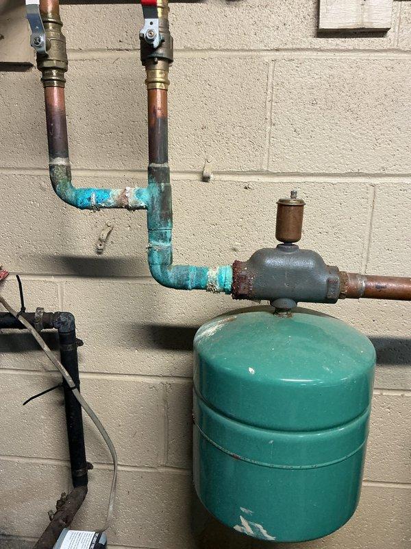 Responded to call regarding boiler malfunction. Inspection revealed significant corrosion around pressure switch and connecting copper piping, particularly at joints and connection points to expansion tank. Replaced corroded pressure switch assembly to restore proper system operation and functionality.