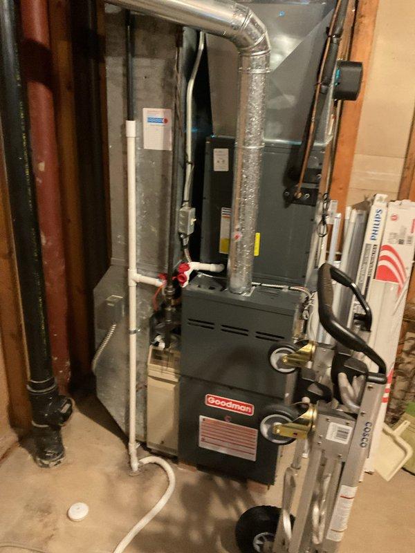 Performed routine heating maintenance on Goodman furnace system. Inspected circuit board connections and wiring harness integrity within control panel. System is functioning properly with all components in good working condition.