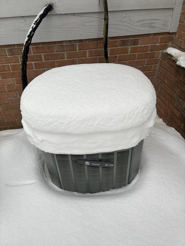Conducted comprehensive evaluation of snow-covered Trane outdoor condensing unit with no heat operation. Documented site conditions including complete snow burial of outdoor equipment and reviewed layout for replacement options. Presented customer with multiple furnace and complete system replacement solutions to address the no-heat situation.
