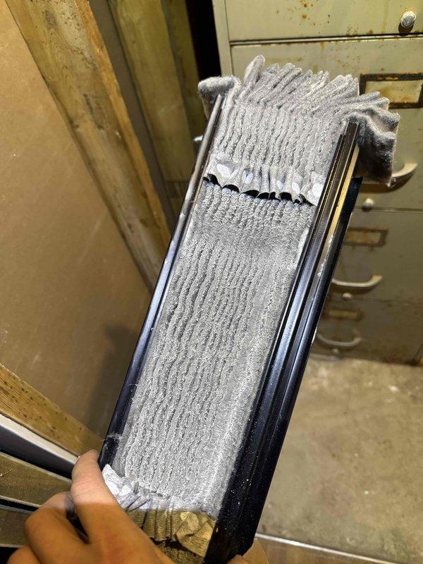 Responded to emergency no-heat call for elderly customer with blank thermostat. Discovered severely clogged air filter restricting airflow and control board failure in 10+ year old PK Wadsworth furnace system. Replaced filter and installed new circuit board to restore heating functionality.