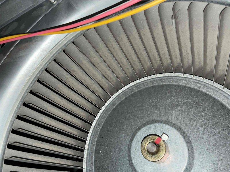 Completed heating maintenance service including inspection of blower wheel assembly and control board. Verified proper electrical connections on the circuit board (CN5T2-D) and examined fan components for functionality. All systems checked and operating normally.