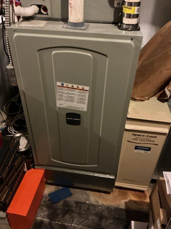 Responded to no-heat call for a residential furnace. Inspected system and found dirty air filter was restricting airflow, causing the furnace to overheat and shut down. Replaced filter and verified proper operation of the Space-Gard air cleaner system. System now functioning normally with adequate heat output.