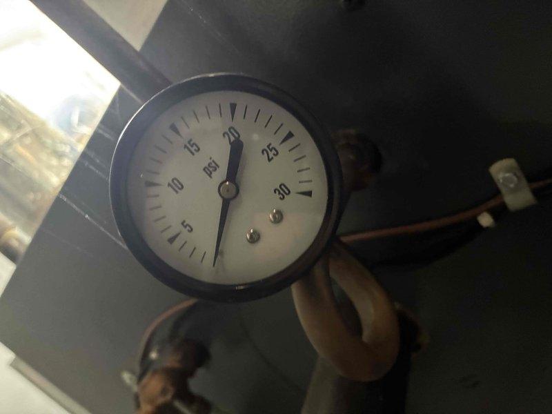 Performed scheduled boiler maintenance service. Inspected electrical connections and found all terminals secure with proper wire routing. Checked system pressure gauge reading approximately 18-20 PSI, which is within normal operating parameters for this boiler system.