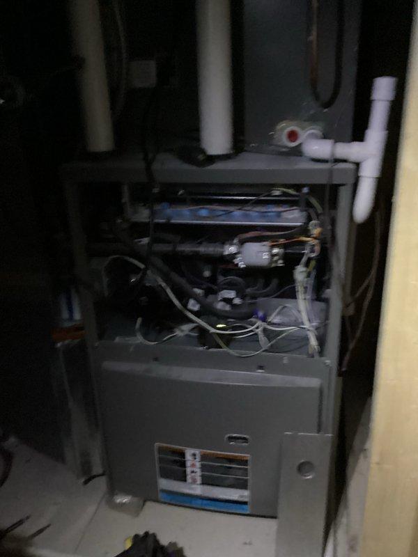 Performed comprehensive heating tune-up on residential furnace system. Conducted electrical diagnostics using multimeter to verify proper voltage readings (225V/69V) across components. Inspected internal mechanical parts, control board functionality, and PVC drainage/ventilation system for optimal performance.