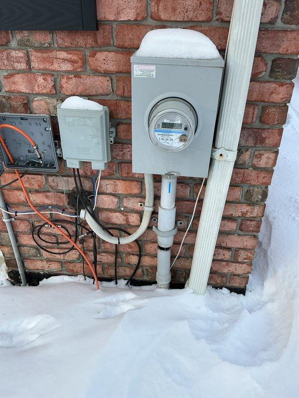 Performed comprehensive electrical inspection of residential panel system and exterior meter installation. Examined laundry room circuitry and connections to ensure proper power supply to appliances. Verified meter functionality and inspected exterior conduits and wiring for weather exposure concerns due to significant snow accumulation.