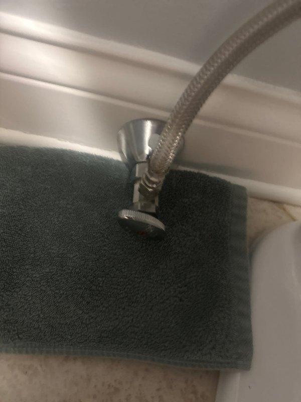 Replaced faulty shut off valve, installing new chrome angle stop with stainless steel braided supply line. Ensured proper connection to wall fixture and verified no leaks upon completion.