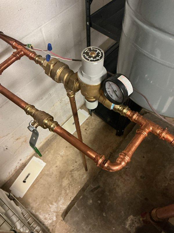 Performed routine maintenance on Weil-McLain boiler heating system. Inspected pressure regulator valve, gauge readings, and all copper pipe connections for proper function. Verified expansion tank integrity and confirmed all plumbing infrastructure is operating within normal parameters.