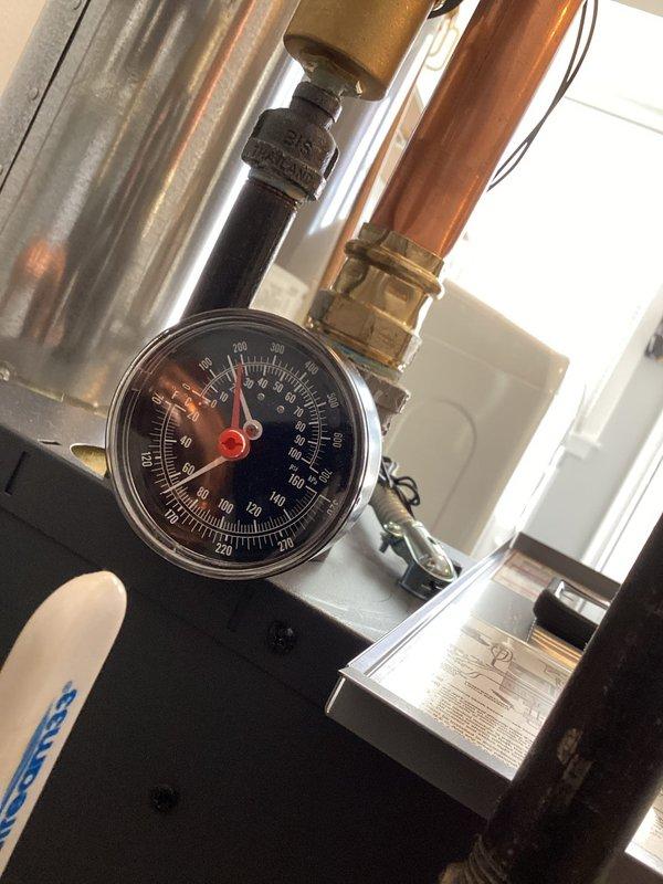 Performed routine maintenance on boiler system. Inspected pressure gauge readings (0-200 PSI range) and verified proper operation. Checked all connections including copper piping with brass fittings and confirmed system integrity per equipment specifications CP8198720.