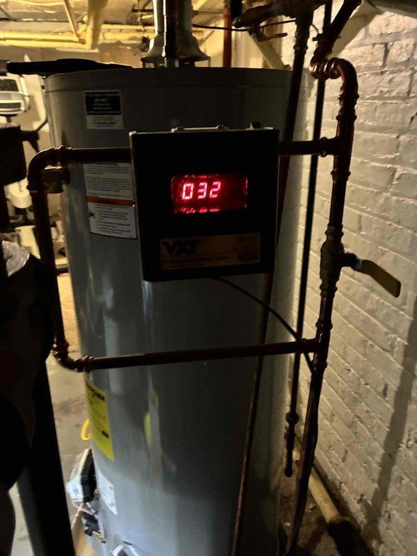 Performed scheduled boiler maintenance service. Inspected control panel showing normal operating temperature (032), checked system pressure which registered at approximately 17-18 PSI (within acceptable range), and verified proper operation of all safety limit controls. All components functioning correctly with no issues identified.