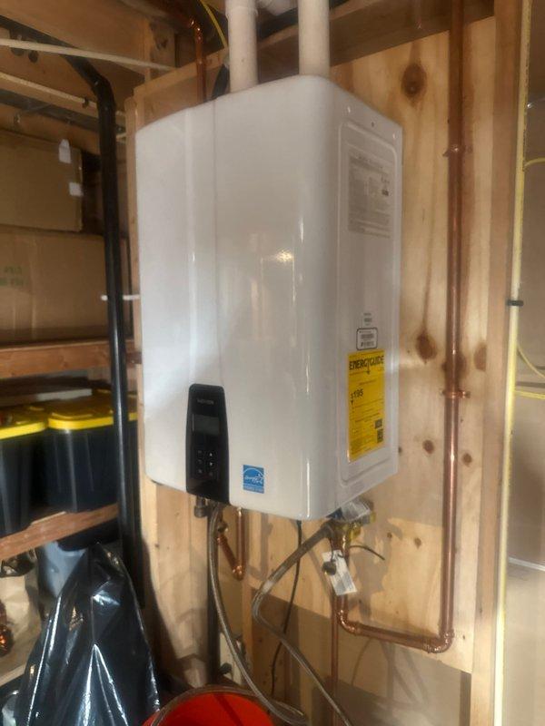 Performed scheduled maintenance on Navien tankless water heater, completing a comprehensive flush and fill service to remove mineral buildup and restore optimal operation. Inspected internal components after removing front panel, ensuring proper function of heat exchangers, fan assembly, and connection points.