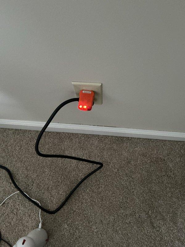Performed inspection and replacement of smoke detectors in residence. Diagnosed electrical grounding issue in one room causing surge protectors to display error indicators. Corrected inverted light switch operation for outdoor lighting fixture.
