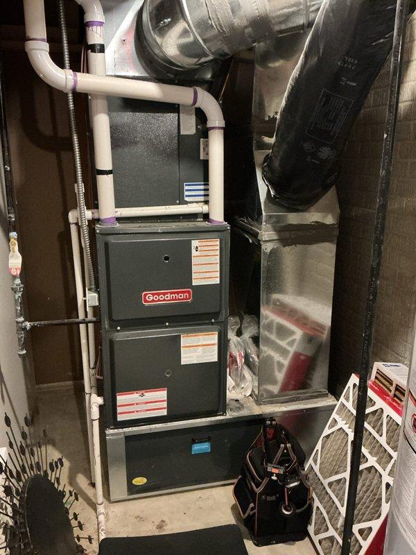 Performed routine heating tune-up on Goodman furnace system located in utility area. Inspected all components including ductwork, ventilation pipes, and connections. Checked water heater operation and expansion tank as part of comprehensive system evaluation. Replaced air filters to ensure optimal airflow and system efficiency.