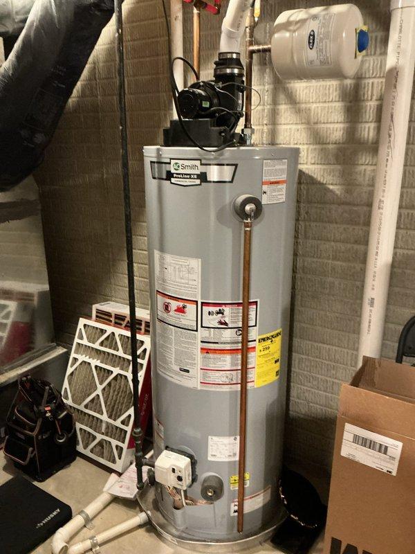 Performed routine heating tune-up on Goodman furnace system located in utility area. Inspected all components including ductwork, ventilation pipes, and connections. Checked water heater operation and expansion tank as part of comprehensive system evaluation. Replaced air filters to ensure optimal airflow and system efficiency.