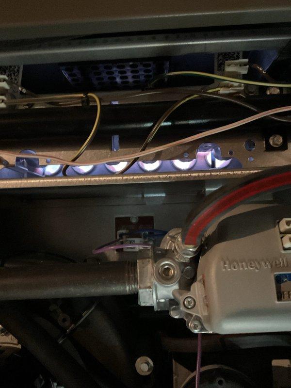 Responded to no-heat call for Lennox furnace displaying 7-flash error code. Upon inspection, accessed internal components and verified proper operation of the ignition sequence. Observed normal blue flame pattern at burners and confirmed Honeywell gas valve functioning correctly. System was restored to normal operation after diagnostic check.