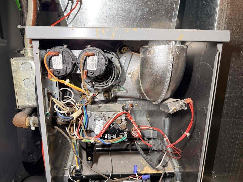 Responded to no heat complaint on aging furnace. Diagnostic inspection revealed faulty circuit board causing system failure. Replaced control board and verified proper operation of pressure switches and draft inducer motor, restoring heat functionality. System now operating within specifications.