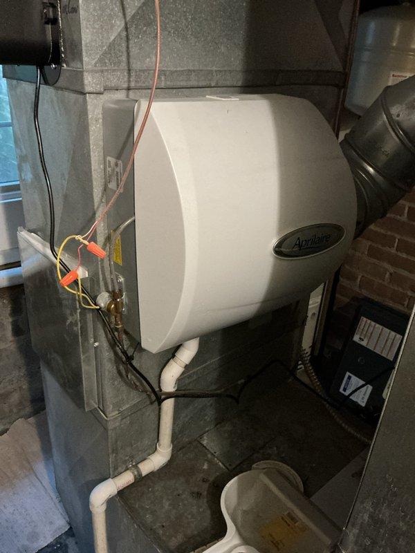 Performed routine maintenance on residential heating system. Inspected Aprilaire humidifier mounted to furnace, checked all electrical connections, and verified proper operation of pressure switches. System is functioning properly with no issues identified.