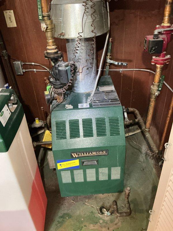 Performed routine maintenance on Williamson water boiler system. Inspected primary components including circulation pump, copper piping, and control valves. Disassembled and cleaned heat exchanger tubes to ensure optimal heat transfer and system efficiency.