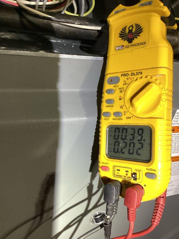 Performed annual maintenance on customer's heating system (less than 1 year old). Conducted electrical testing with multimeter showing normal amperage readings of 0.39A/0.202A. Inspected control board connections and verified proper wiring harness configuration. All components functioning within specifications; system is operating efficiently.