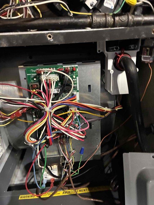 Performed annual maintenance on customer's heating system (less than 1 year old). Conducted electrical testing with multimeter showing normal amperage readings of 0.39A/0.202A. Inspected control board connections and verified proper wiring harness configuration. All components functioning within specifications; system is operating efficiently.