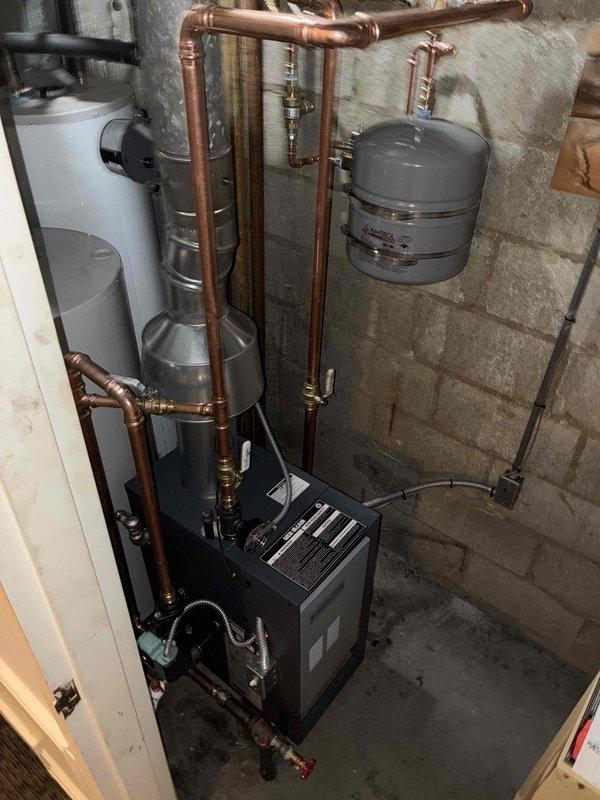 Successfully installed a new boiler system with integrated hot water tank in the utility area. Completed all necessary copper piping connections, installed expansion tank, and ensured proper gas line connections with appropriate valves. System was tested and is functioning according to specifications.