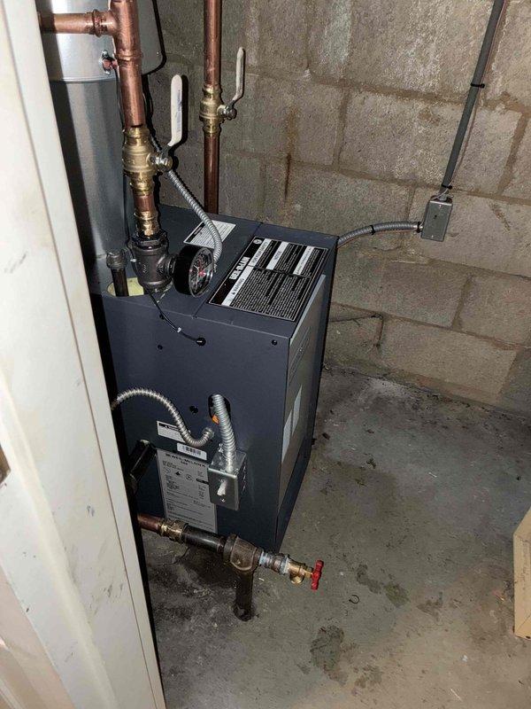 Successfully installed a new boiler system with integrated hot water tank in the utility area. Completed all necessary copper piping connections, installed expansion tank, and ensured proper gas line connections with appropriate valves. System was tested and is functioning according to specifications.