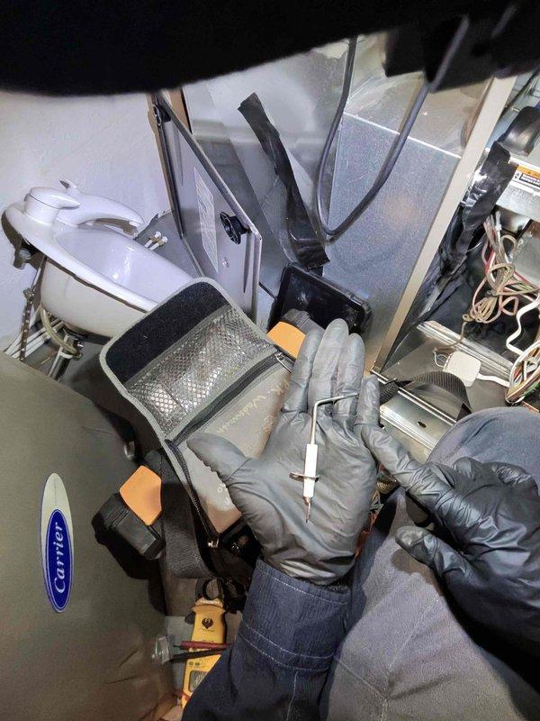 Performed scheduled heating maintenance on an aging Carrier system (10+ years old). Conducted comprehensive diagnostic testing of components and replaced the pleated air filter which showed significant dust accumulation. System was returned to proper operating condition after service.