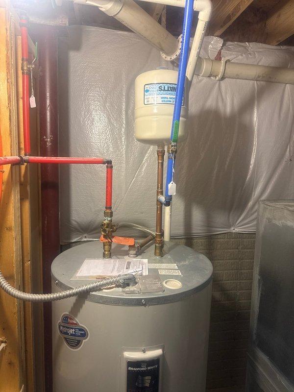 Performed scheduled maintenance on Bradford White tanked water heater. Inspected all connections including copper hot water lines, PVC piping, and expansion tank. Confirmed proper installation of gas supply line and verified unit was functioning according to manufacturer specifications.