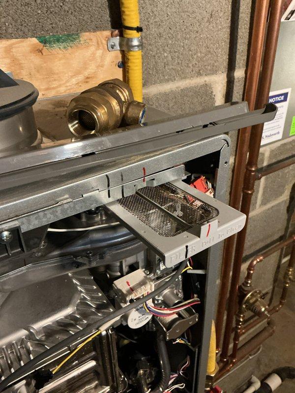 Performed scheduled maintenance on water boiler system. Inspected Rinnai unit, checked pressure gauge readings, and examined all copper piping, valves, and gas line connections. Cleaned metal mesh filter and verified proper operation of all components.