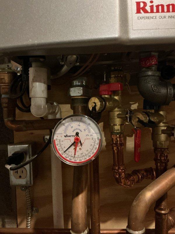 Performed scheduled maintenance on water boiler system. Inspected Rinnai unit, checked pressure gauge readings, and examined all copper piping, valves, and gas line connections. Cleaned metal mesh filter and verified proper operation of all components.