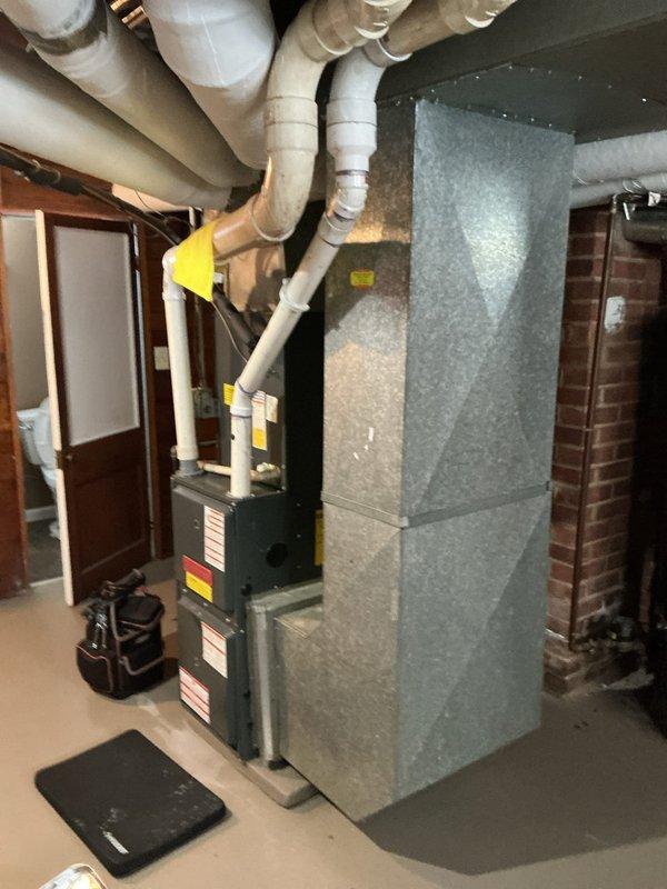 Performed standard heating tune-up on basement furnace system. Inspected air handler, ductwork, and ventilation components for proper operation. Verified all PVC exhaust/intake piping connections were secure and functioning correctly.