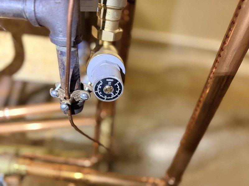 Performed comprehensive inspection of boiler system and associated components. Checked pressure gauge readings and verified proper operation of all valves and fittings. Inspected Rinnai tankless water heater installation, confirming proper function and connections of copper supply lines and PVC drainage system.