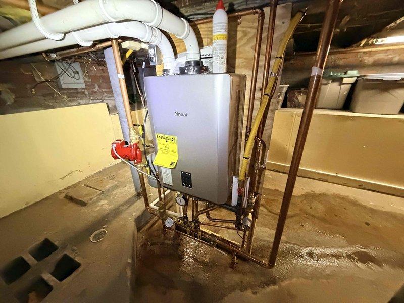 Performed comprehensive inspection of boiler system and associated components. Checked pressure gauge readings and verified proper operation of all valves and fittings. Inspected Rinnai tankless water heater installation, confirming proper function and connections of copper supply lines and PVC drainage system.
