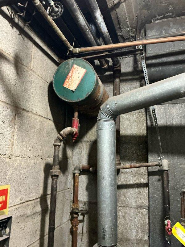Responded to no-heat call at Susan's residence. Accessed basement utility area through exterior cellar entrance. Inspected boiler system and associated components including expansion tank and connected piping. Identified issue and restored heating functionality.