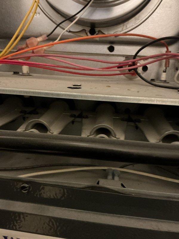 Responded to no heat complaint on unit that had been inoperative for approximately one week. Performed diagnostic inspection of furnace interior components including burner assembly, heat exchanger, and electrical connections. Restored heating functionality and verified proper system operation before departure.