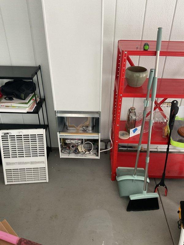 Responded to service call for non-functioning Cozy garage heater installed approximately 10 months ago. Upon inspection, diagnosed issues with the wall-mounted thermostat and heating unit in sunroom where temperatures had dropped to the 30's. Performed necessary repairs to restore proper operation of the heating system.