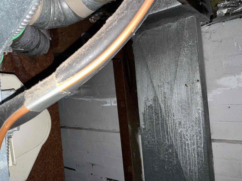 Performed assessment of existing HVAC system showing significant deterioration, with visible dust accumulation on ductwork and aging components. Presented furnace replacement options to customer due to complete heat failure, along with available financing solutions.