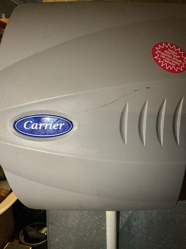 Performed monthly heating maintenance on a Carrier furnace. Inspected burner assembly and verified proper flame pattern with consistent blue flames. System is operating correctly with no issues observed.