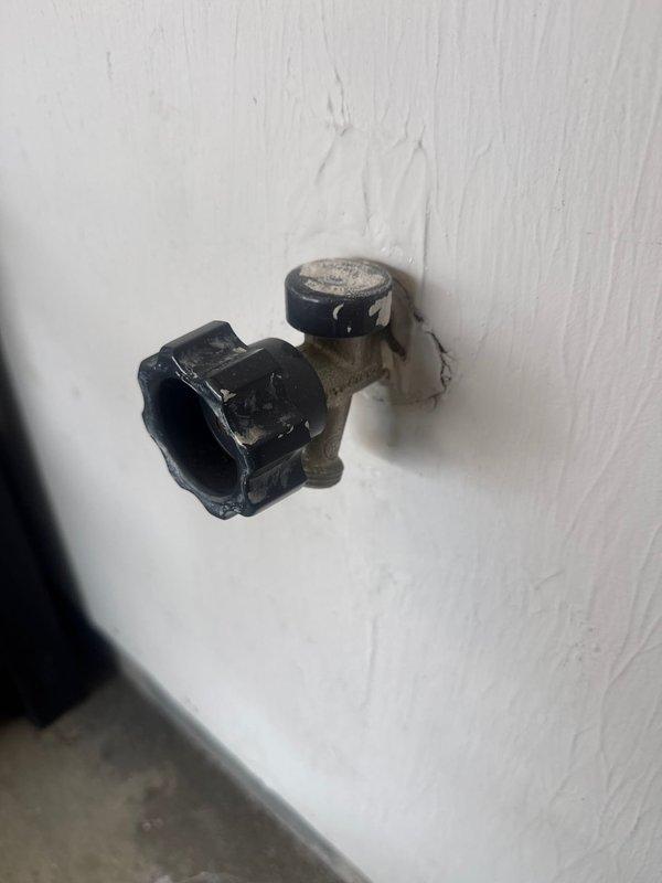 Replaced leaky garage faucet with new unit. Removed old fixture showing mineral deposits and wear on valve components. Installed new spigot, ensuring proper connection to existing plumbing and confirming no leaks after installation.