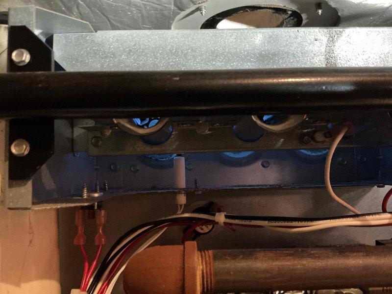 Performed diagnostic inspection on customer's gas heating system due to safety concerns. Examined interior components including blower motor assembly, Honeywell control valve, and electrical connections. All wiring, piping, and mechanical elements were found to be properly installed and functioning normally; system is safe for operation.