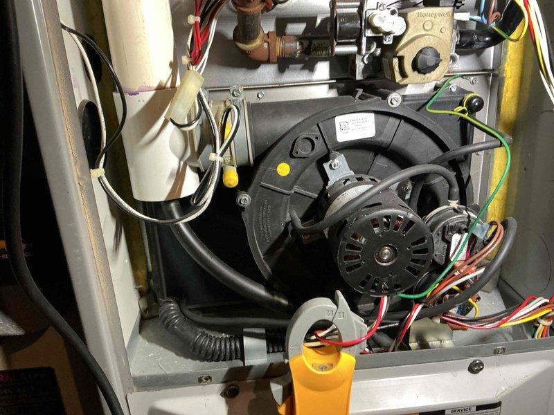 Performed diagnostic inspection on customer's gas heating system due to safety concerns. Examined interior components including blower motor assembly, Honeywell control valve, and electrical connections. All wiring, piping, and mechanical elements were found to be properly installed and functioning normally; system is safe for operation.