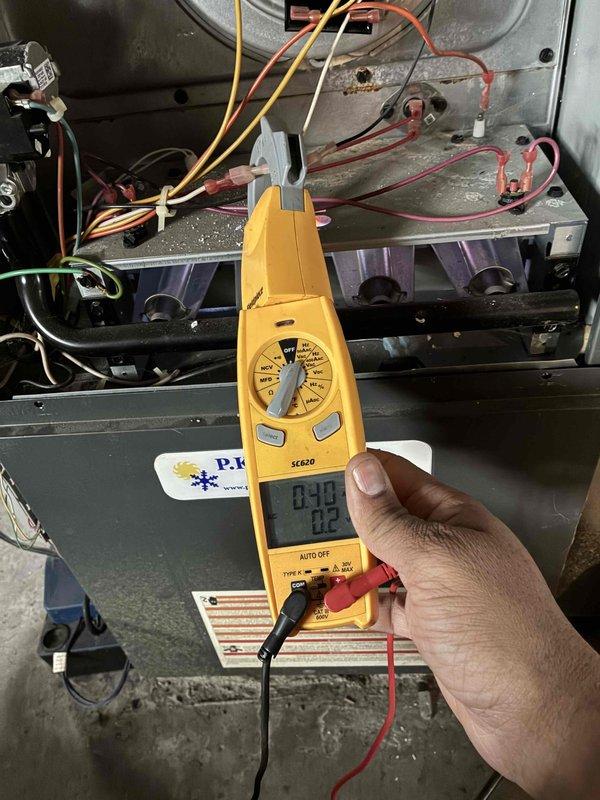 Performed routine heating tune-up including electrical system diagnostics with voltage testing of the HVAC unit terminals (readings: 0.9/172V). Inspected heat exchanger fins and copper tubing for proper condition, with no significant corrosion or damage observed. System verified operational with standard maintenance completed.