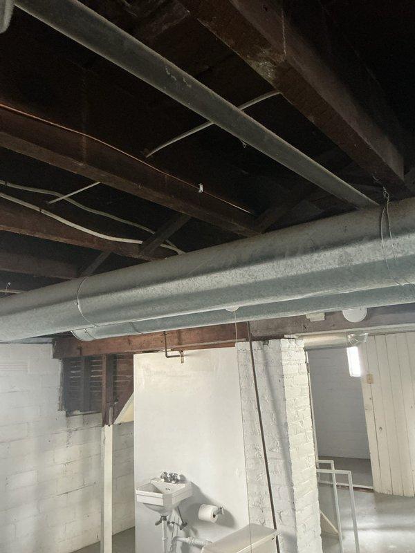 Completed grounding system upgrade in unfinished basement area. Installed new main grounding electrode conductor and bonding connections to meet current electrical code requirements. Verified proper continuity and resistance values for all ground connections at electrical panel.