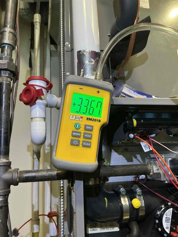 Performed monthly heating maintenance service on HVAC system. Conducted pressure readings with UEI EM2018 digital meter showing 235.7 on supply lines. Inspected control board and wiring connections, noting all wire harnesses secure with no signs of damage or overheating.