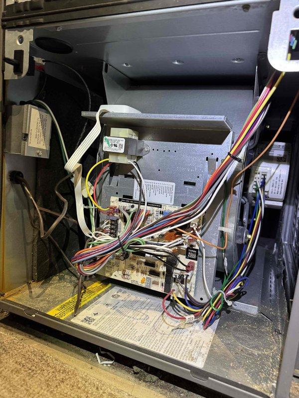 Performed monthly heating maintenance service on HVAC system. Conducted pressure readings with UEI EM2018 digital meter showing 235.7 on supply lines. Inspected control board and wiring connections, noting all wire harnesses secure with no signs of damage or overheating.